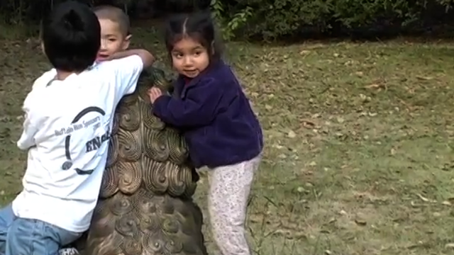 Tania Playing in the Yard